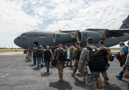 Members of the 290th Joint Communications Support Squadron board a C-17 Globemaster III aircraft at MacDill Air Force Base, Fla., April 8, 2019, for exercise Bold Quest. Bold Quest is an annual exercise where military and civilian members, developers and analysts work in a cooperative network with partner nations, finding technical and procedural solutions to improve coalition warfighting interoperability.