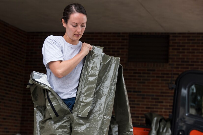 Capt. Malory Morris, a dentist assigned to the 628th Aerospace Medical Squadron, puts on her personal protective equipment during an exercise May 9, 2019, at Joint Base Charleston, S.C.