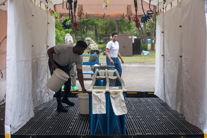 Airmen from the 628th Medical Group set up a decontamination tent during an exercise May 9, 2019, at Joint Base Charleston, S.C.