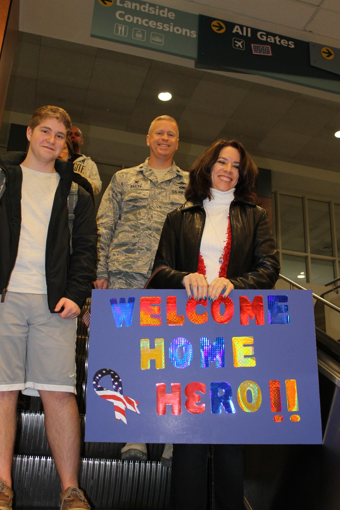 (The Kelley family welcomes then Lt. Col. Kelly Bailey home from deployment. Photo courtesy of Mrs. Lynne Bailey)