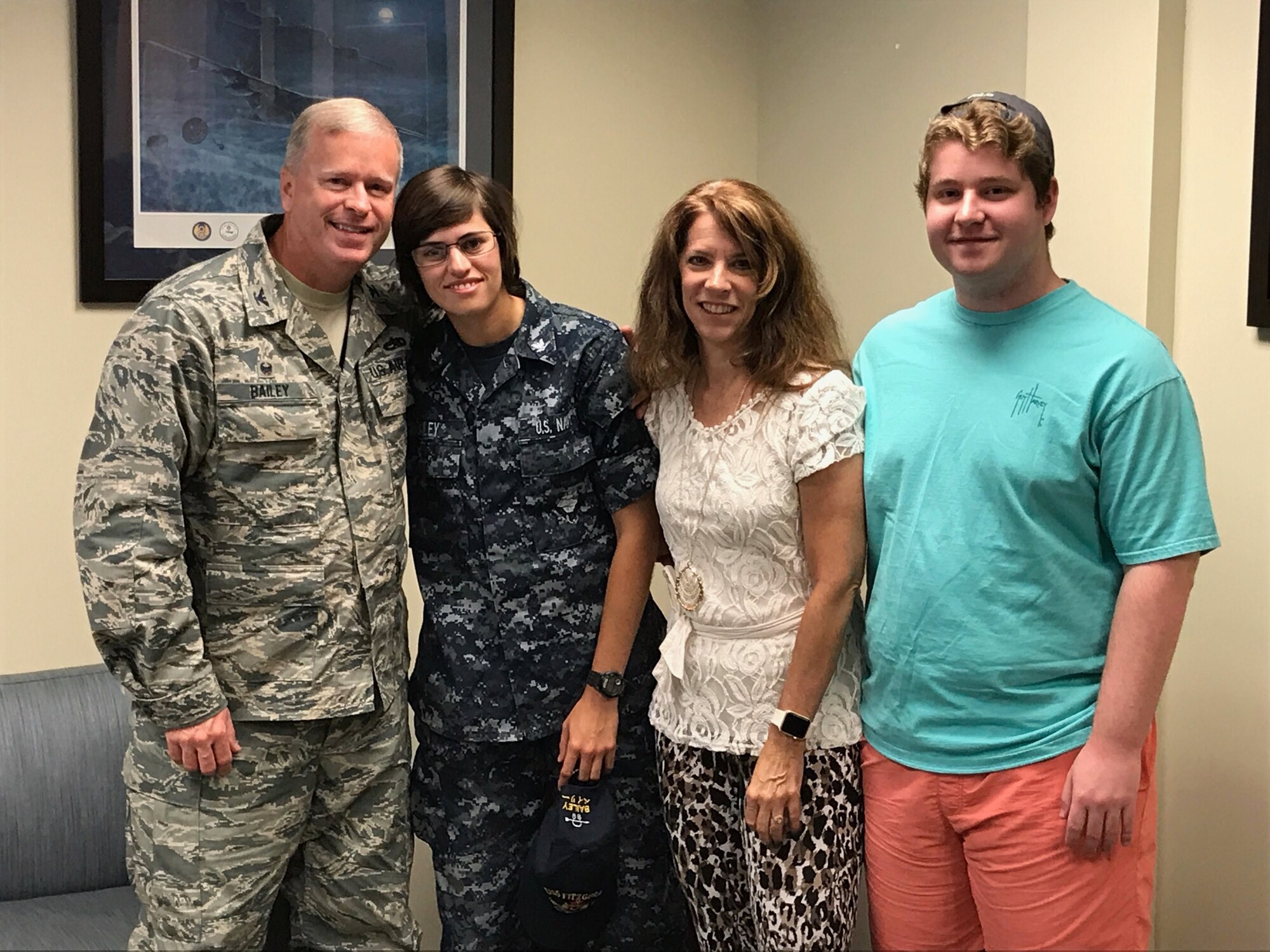 (The Bailey family poses for a photo during a surprise visit from their daughter, a petty officer second class in the U.S. Navy. Photo courtesy of Mrs. Lynne Bailey)