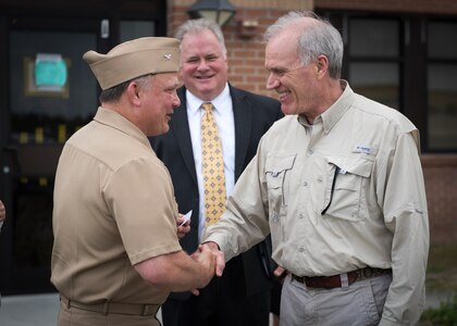 Capt. Aaron Peters, Naval Surface Warfare Center Panama City (NSWC PCD) commanding officer, shakes hands with Secretary of the Navy, Richard V. Spencer, May 10 during a tour of NSWC PCD. U.S. Navy photo by Anthony Powers