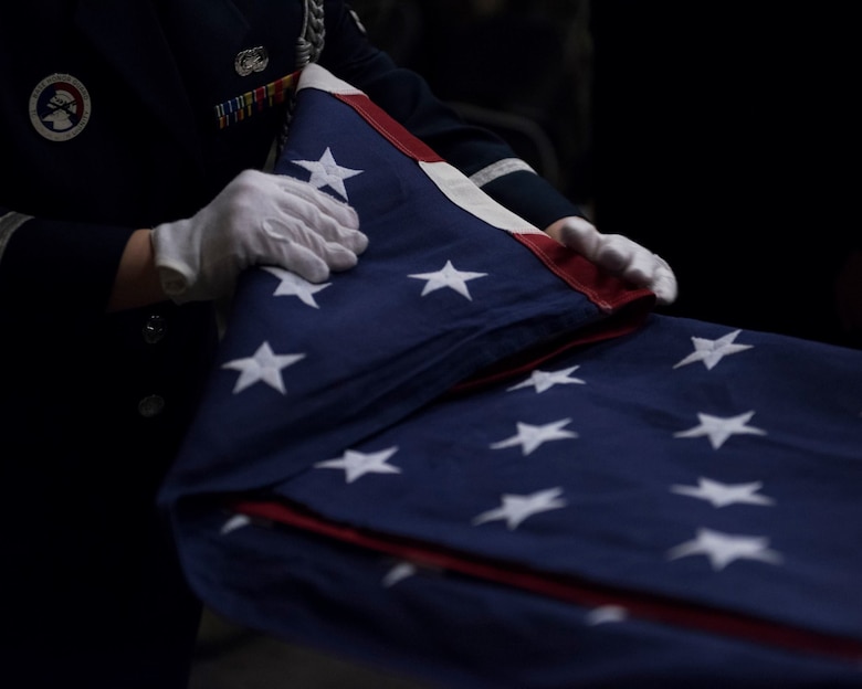 The Mountain Home Air Force Base honor guard conduct a ceremony April 5, 2019 at their ceremonial unit. The flag is folded as a part of a ceremony. (U.S. Air Force photo by Airman First Class Hailey Robertson)