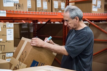 Isaias Elizondo, 502nd Logistics Readiness Squadron materials technician, inventories new uniforms May 1, 2019, at Joint Base San Antonio-Lackland, Texas. The 502nd LRS supports the basic military training mission by supplying initial uniforms to 39,000 trainees annually. (U.S. Air Force photo by Senior Airman Stormy Archer)