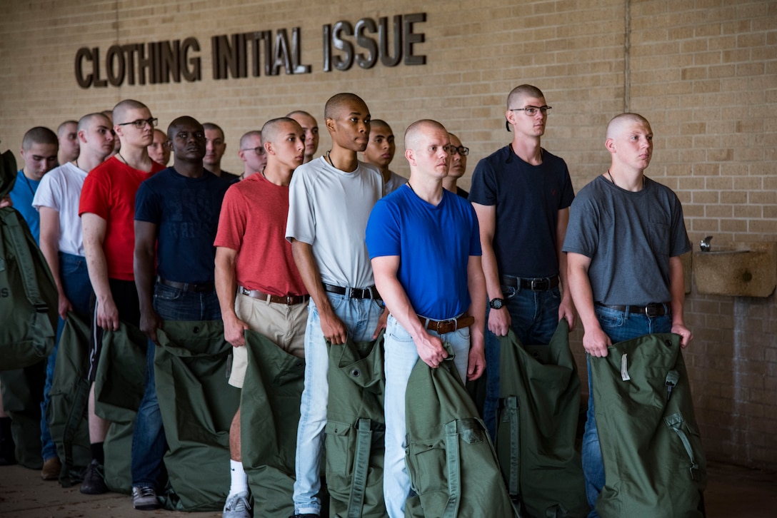 Trainees line up for initial clothing issue May 1, 2019, at Joint Base San Antonio-Lackland, Texas. Between 300 and 400 trainees receive their first sets of uniforms weekly from initial clothing issue. (U.S. Air Force photo by Senior Airman Stormy Archer)