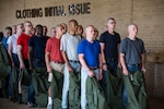 Trainees line up for initial clothing issue May 1, 2019, at Joint Base San Antonio-Lackland, Texas. Between 300 and 400 trainees receive their first sets of uniforms weekly from initial clothing issue. (U.S. Air Force photo by Senior Airman Stormy Archer)