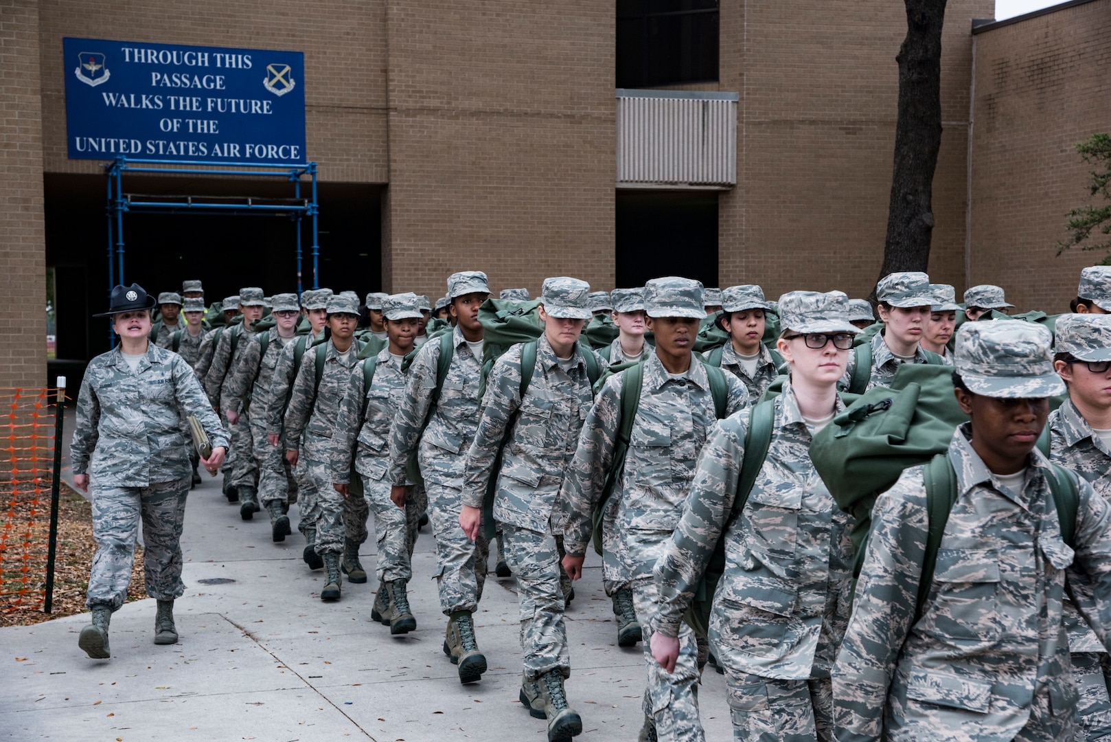 Trainees leave initial clothing issue with their first sets of uniforms May 1, 2019, at Joint Base San Antonio-Lackland, Texas. Between 300 and 400 trainees receive their first sets of uniforms weekly from initial clothing issue. (U.S. Air Force photo by Senior Airman Stormy Archer)