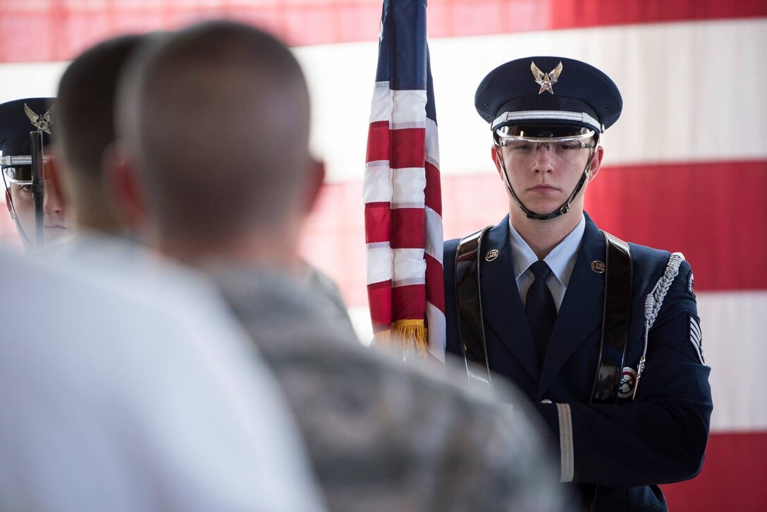 The Mountain Home Air Force Base honor guard present the colors April 5, 2019 at their ceremonial unit. The colors are presented at the beginning of ceremonies. (U.S. Air Force photo by Senior Airman Samuel Morse)
