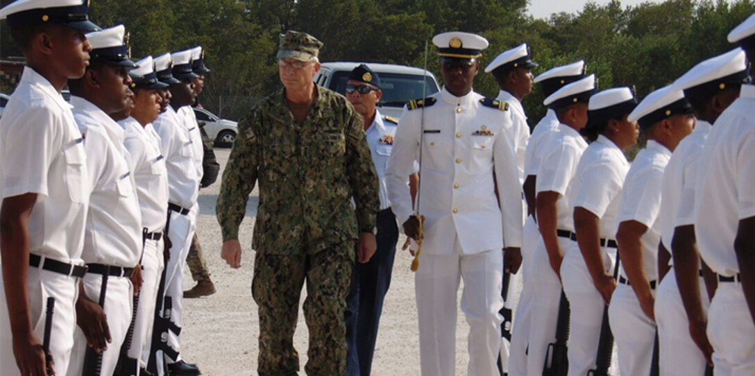 The commander of U.S. Southern Command, Navy Adm. Craig Faller, visits the headquarters of the Belize Coast Guard.