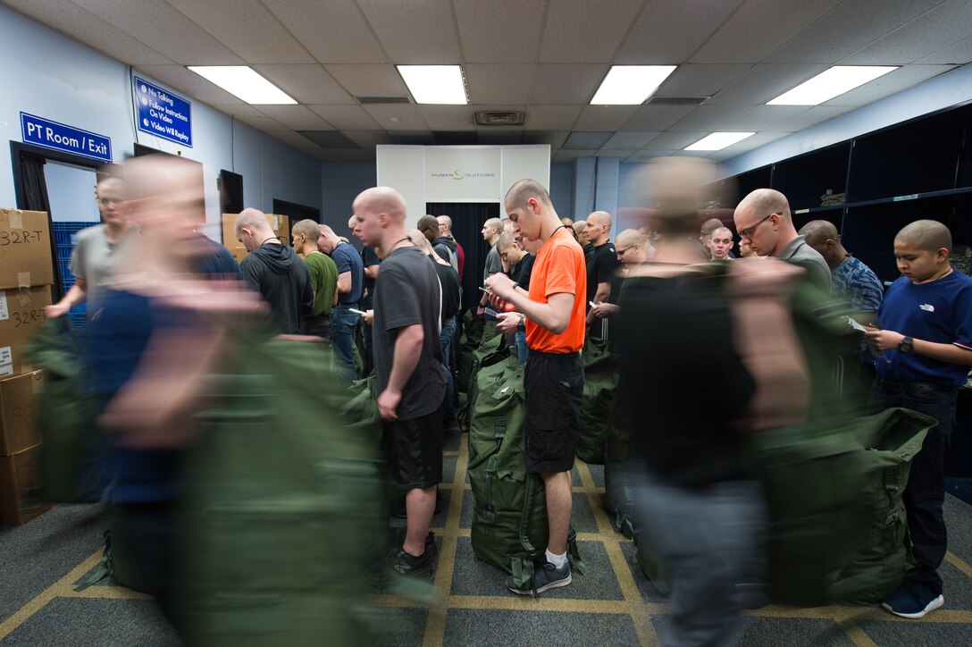 U.S. Air Force basic military training trainees receive their initial gear during clothing issue, Feb. 13, 2019, at Joint Base San Antonio-Lackland, Texas. The 502d LRS is responsible for issuing and fitting individual uniforms for more than 1,600 BMT trainees weekly. (U.S. Air Force photo by Sarayuth Pinthong)