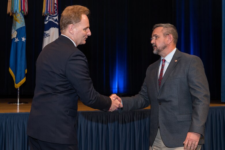 The Honorable David L. Norquist, performing the duties of The Deputy of the Secretary of Defense, and Sajeel S. Ahmed, Acting Director of Administration and Organizational Policy Office of the Chief Managment Officer, host the Spirit of Service Ceremony at the Pentagon in Arlington, Va., May 9, 2019. Mark Brown, the head of the U.S. Marine Corps’ installation emergency management program, was recognized for his outstanding job performance and humanitarian work. (U.S. Army photo by Spc. Zachery Perkins)