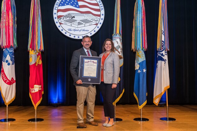 The Honorable David L. Norquist, performing the duties of The Deputy of the Secretary of Defense, and Sajeel S. Ahmed, Acting Director of Administration and Organizational Policy Office of the Chief Managment Officer, host the Spirit of Service Ceremony at the Pentagon in Arlington, Va., May 9, 2019. Mark Brown, the head of the U.S. Marine Corps’ installation emergency management program, was recognized for his outstanding job performance and humanitarian work. (U.S. Army photo by Spc. Zachery Perkins)