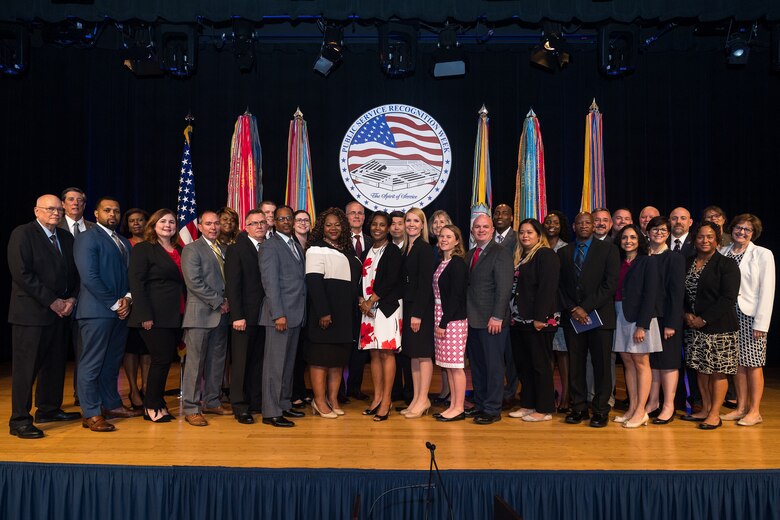 The Honorable David L. Norquist, performing the duties of The Deputy of the Secretary of Defense, and Sajeel S. Ahmed, Acting Director of Administration and Organizational Policy Office of the Chief Managment Officer, host the Spirit of Service Ceremony at the Pentagon in Arlington, Va., May 9, 2019. Mark Brown, the head of the U.S. Marine Corps’ installation emergency management program, was recognized for his outstanding job performance and humanitarian work. (U.S. Army photo by Spc. Zachery Perkins)