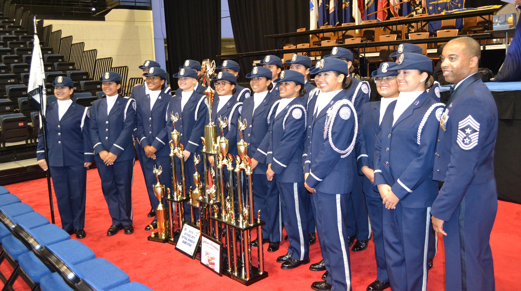 U.S. Air Force Chief Master Sgt. Jermaine Evans, Holm Center command chief, stands with the Silver Valor Air Force Junior Reserve Officer Training Corps cadets from Tom C. Clark High School, San Antonio, Texas, during the National High School Drill Team Competition May 3-5 2019, at Daytona Beach, Fla.  Silver Valor won trophies for five events and placed second overall in the unarmed competition.