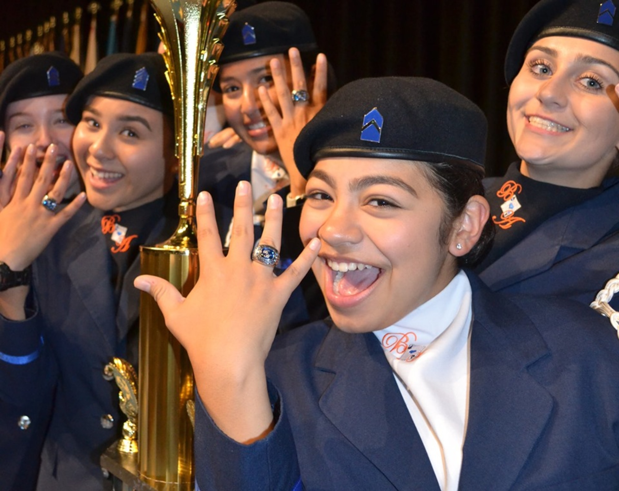 Air Force Junior Reserve Officer Training Corps cadets from Louis D. Brandeis High School, San Antonio, Texas, showcase the rings they received from the 2018 National High School Drill Team Competition following their 2019 victory in the same event May 3-5 2019, at Daytona Beach, Fla. The cadets were the first team in 35 years to accomplish consecutive victories in the competition.