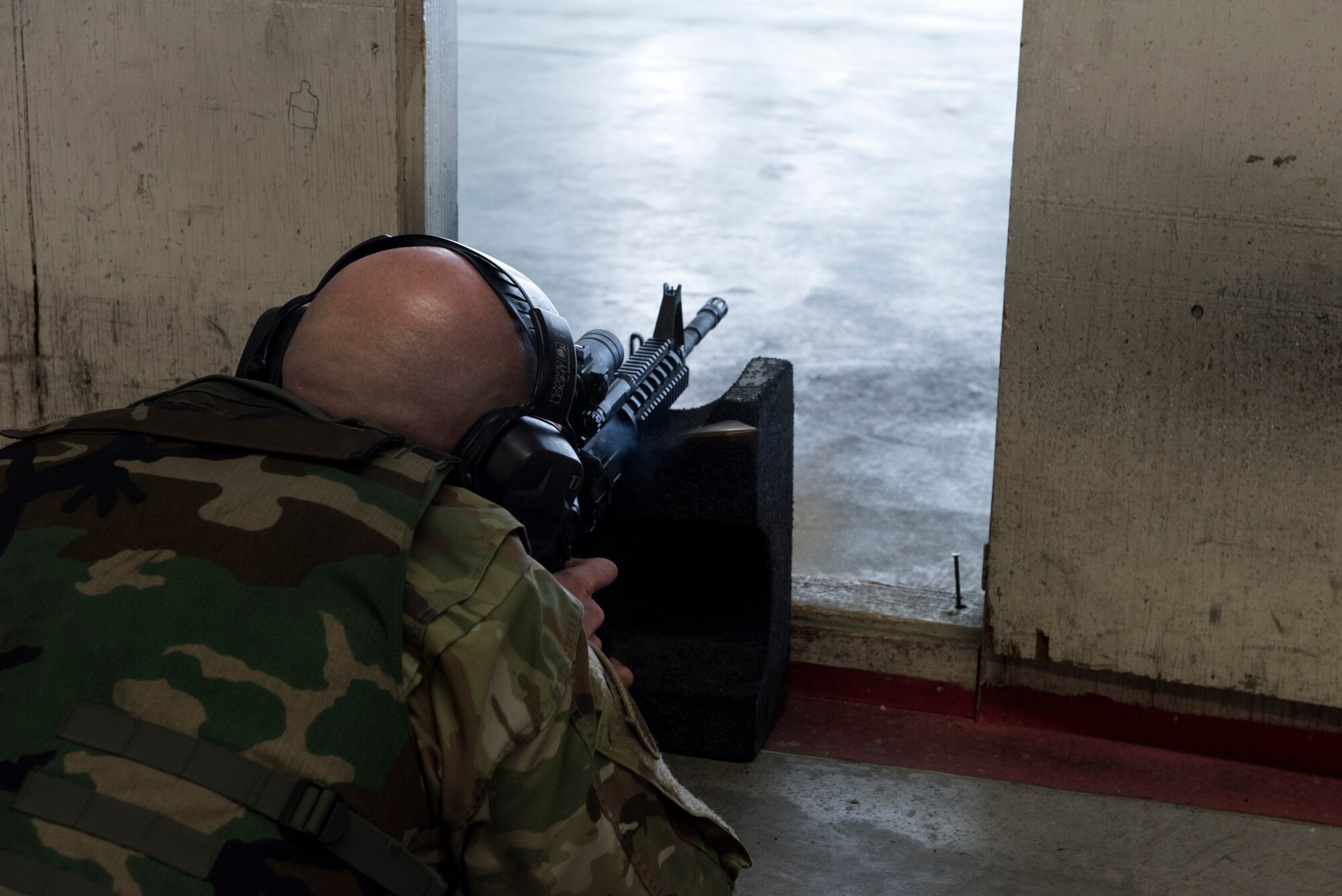 Tech Sgt. Joshua Armstrong, 366th Operations Support Squadron air traffic controller, fires his weapon in the prone position April 25, 2019, at Mountain Home Air Force Base, Idaho. Airmen learn how to safely operate weapons in the Combat Arms Training and Maintenance class. (U.S. Air Force Photo by Airman 1st Class Hailey Bivens)