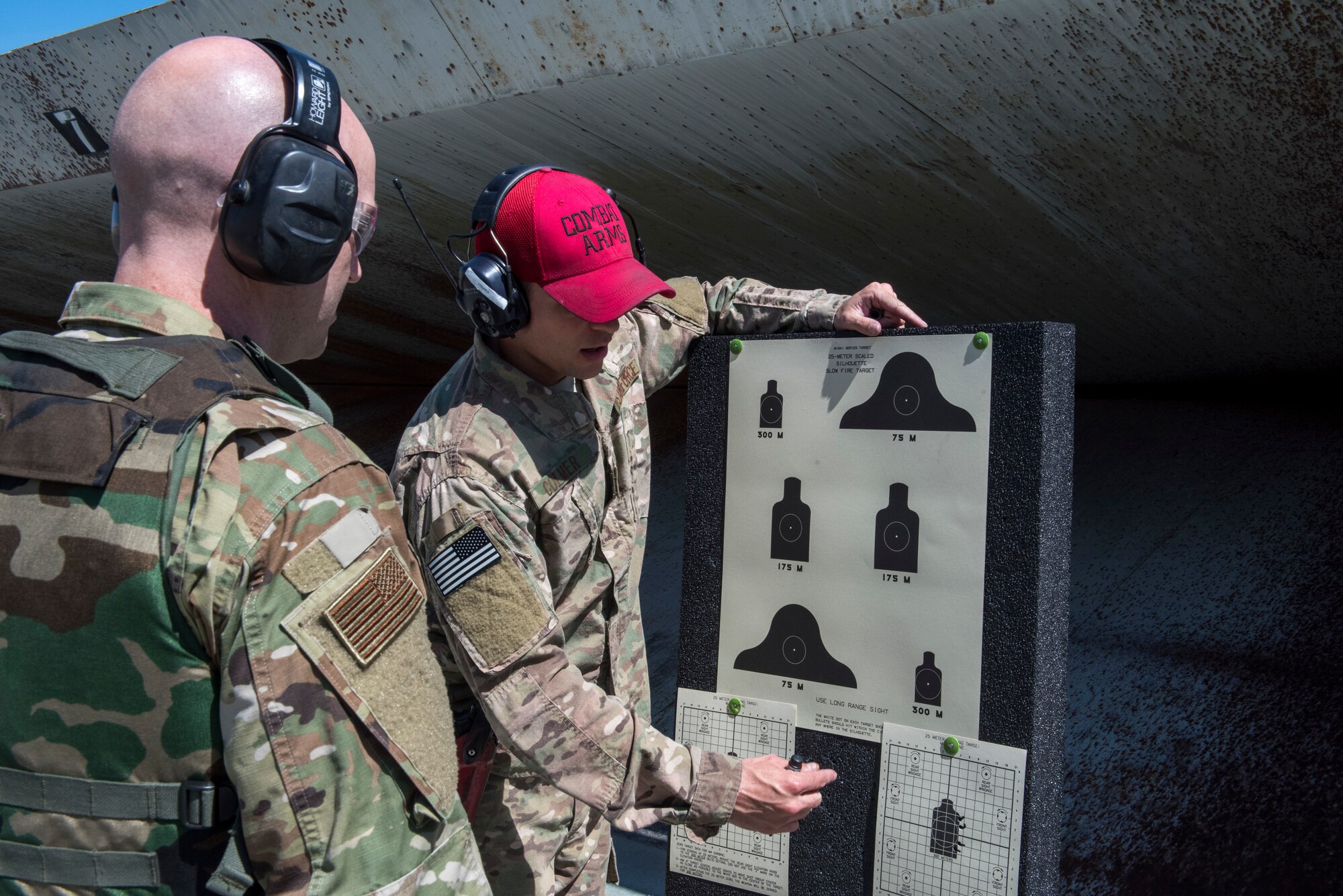 Staff Sgt. Justin Colmer, 366th Security Forces Squadron combat arms instructor, assists Tech Sgt. Joshua Armstrong, 366th Operations Support Squadron air traffic controller, with making sight corrections to his weapon April 25, 2019, at Mountain Home Air Force Base, Idaho. Combat Arms training helps Airmen remain confident in their ability to safely operate issued weapons. (U.S. Air Force Photo by Airman 1st Class Hailey Bivens)