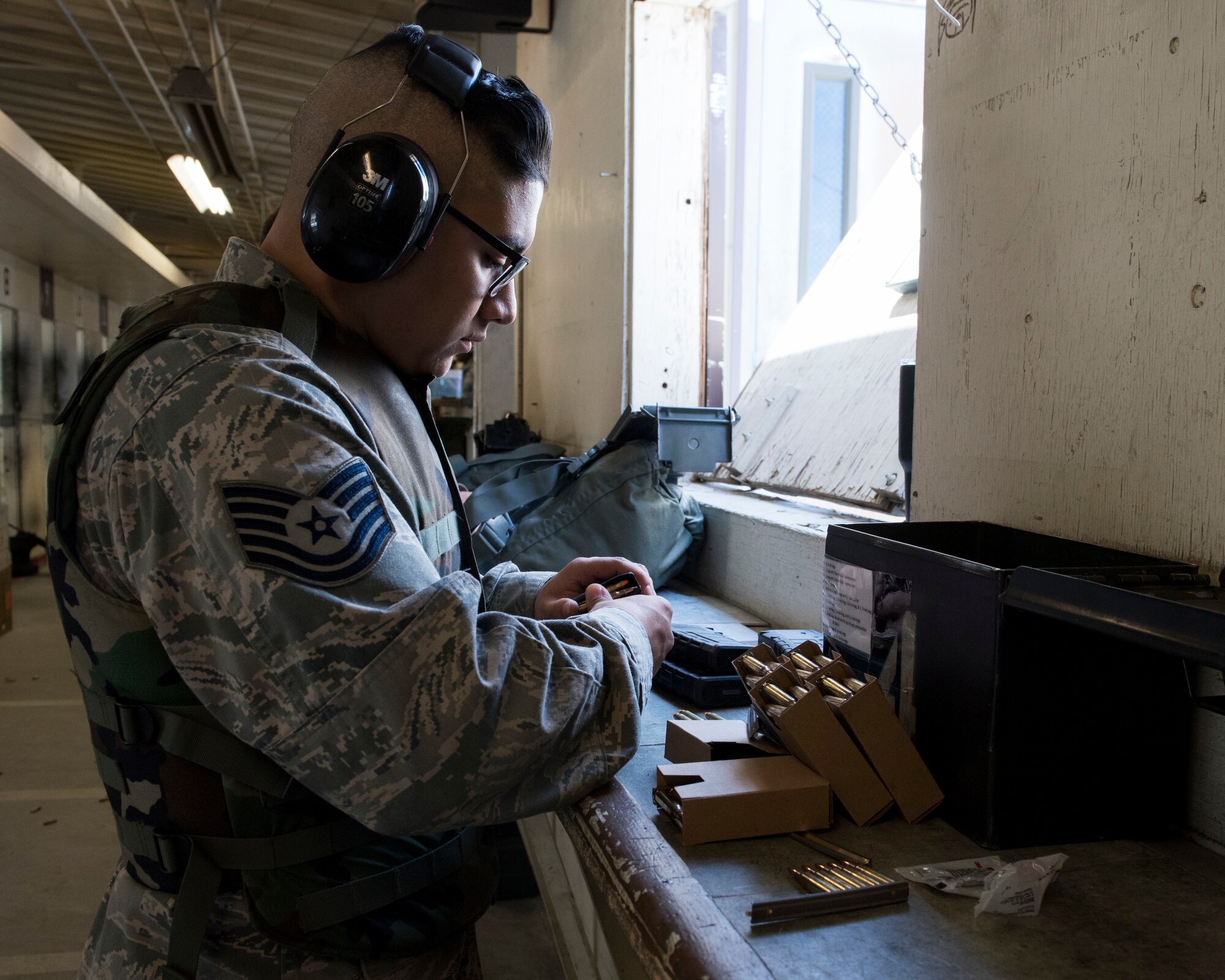 An Airman loads ammunition into his clip before receiving instructions April 25, 2019, at Mountain Home Air Force Base, Idaho. Airmen receive Combat Arms Training to ensure they are confident using their issued weapons. (U.S. Air Force Photo by Airman 1st Class Hailey Bivens)