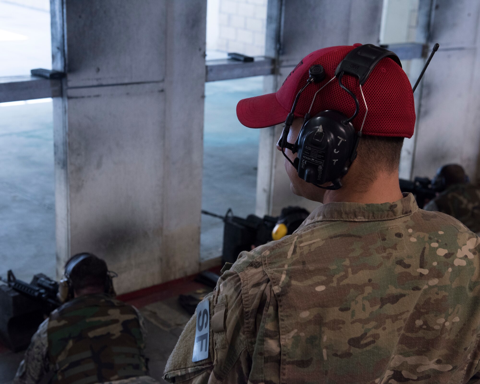 Staff Sgt. Justin Colmer, 366th Security Forces Squadron combat arms instructor, observes his students as they fire their weapons April 25, 2019, at Mountain Home Air Force Base, Idaho. Airmen learn how to safely operate issued weapons in the Combat Arms Training and Maintenance class. (U.S. Air Force Photo by Airman 1st Class Hailey Bivens)
