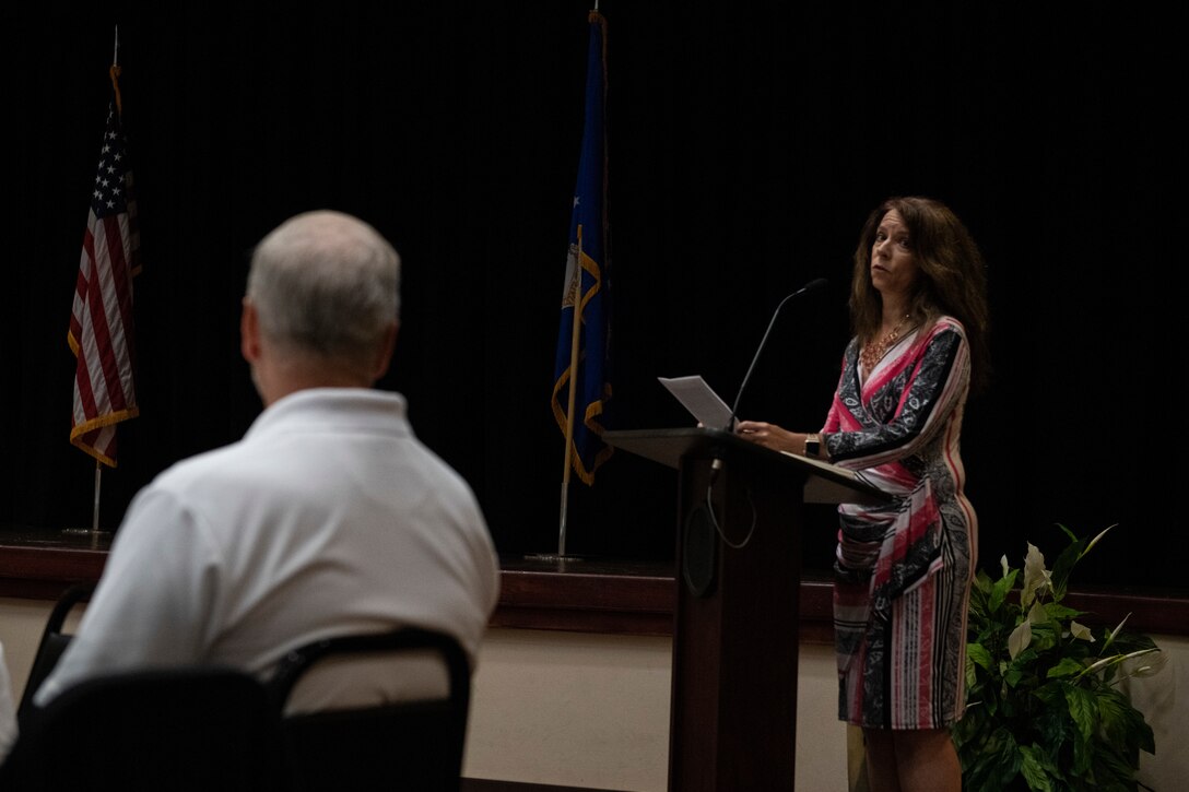 Lynne Bailey looks at her husband Kelly Bailey, director of the 97th Maintenance Group, while making a speech at the 97 AMW Military Spouse Appreciation lunch, May 10, 2019, Altus Air Force Base, Okla. The event was held to honor the work military spouses do for base personnel and the wing. (U.S. Air Force photo by Airman 1st Class Jeremy Wentworth)