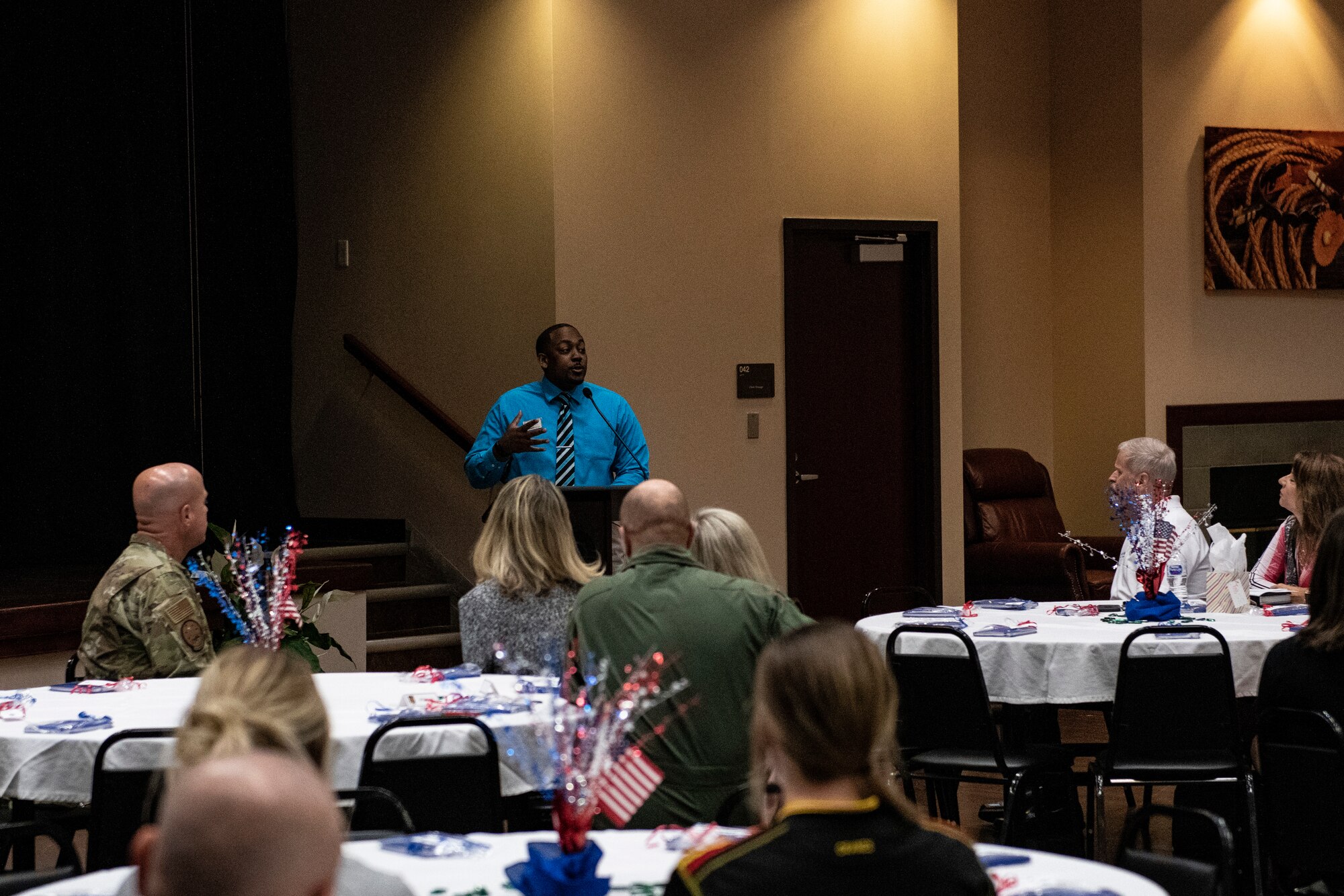 Anthony Vaughans, husband of Maj. Marshalria Vaughans, commander of the 97 Communications Squadron, talks to an audience at the 97 AMW Military Spouse Appreciation lunch, May 10, 2019, Altus Air Force Base, Okla. Anthony talked about life as a male military spouse and where he has been in their career. (U.S. Air Force photo by Airman 1st Class Jeremy Wentworth)