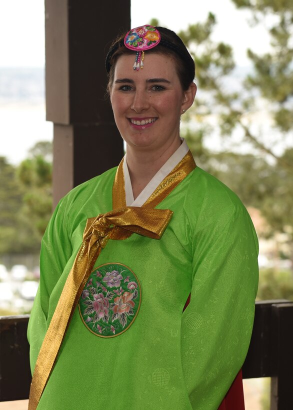 Staff Sgt. Sydney Manning, 314th Training Squadron student, is studying Korean and participated in Language Day, along with other members from her class, by doing a native fan dance during the event at Presidio of Monterey, Calif., May 10, 2019. Over the years Language Day has grown, this year the event hosted over 6,000 individuals dwarfing the original celebration in 1952. (U.S. Air Force photo by Airman 1st Class Zachary Chapman/Released)