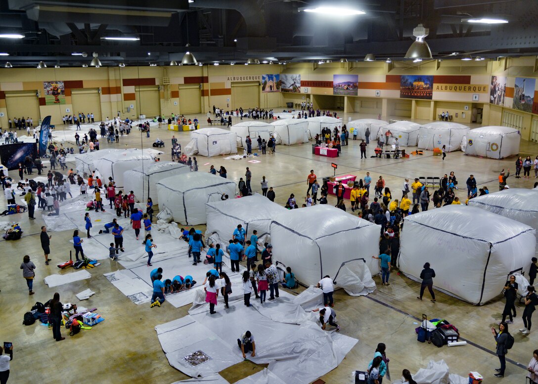 Student inflate habitats during the 2019 Mission to Mars at the Albuquerque Convention Center May 10. The Air Force Research Laboratory New Mexico’s STEM Outreach branch put on the mission, with more than 1,300 fifth-grade students from schools across the Albuquerque area and New Mexico taking part in the massive science and engineering experiment. (U.S. Air Force photo by Jim Fisher)