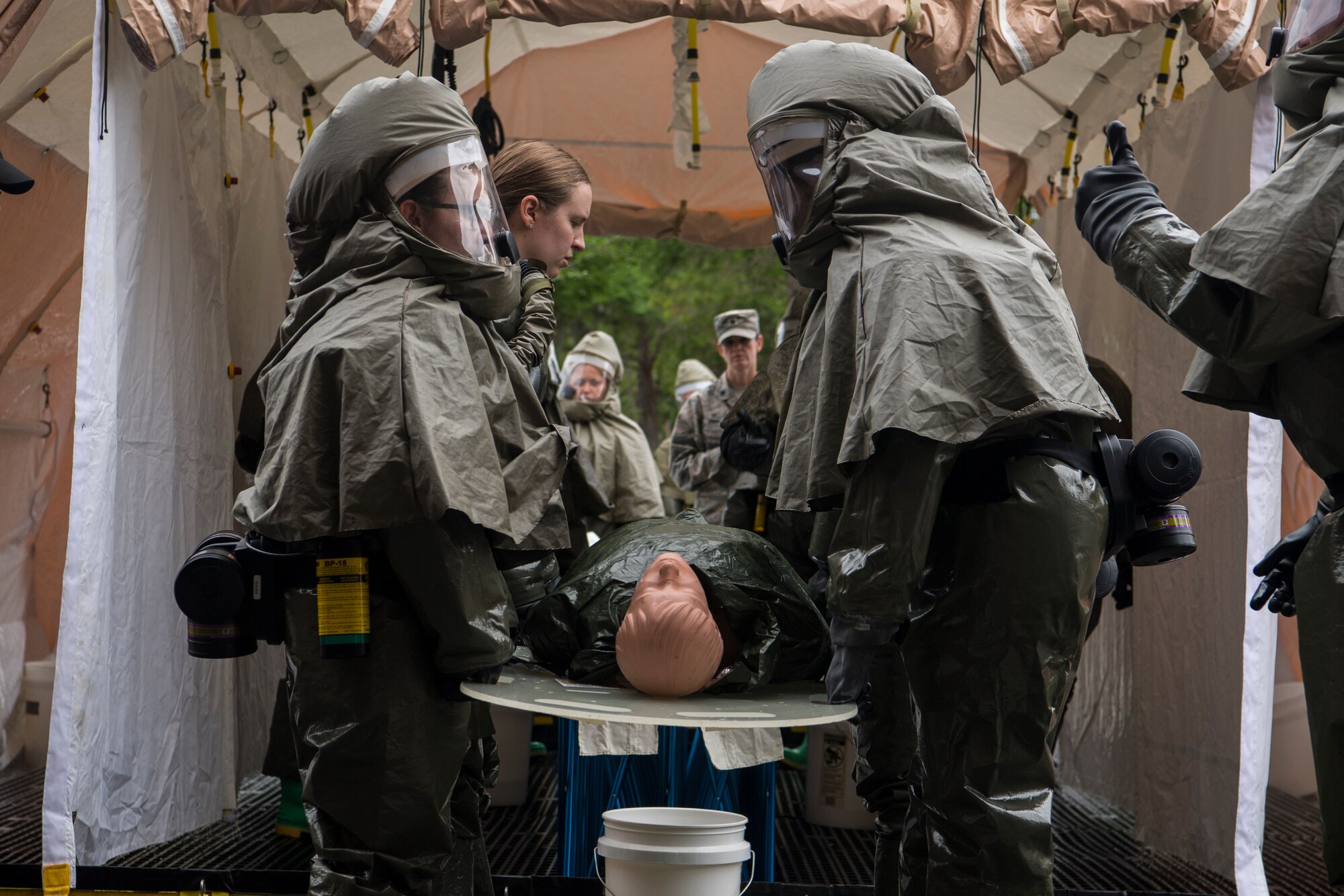 Airmen from the 628th Medical Group prepare to move a simulated casualty during an exercise May 9, 2019, at Joint Base Charleston, S.C. The 628th MDG conducted a joint certification course, including an intensive patient decontamination exercise, to prepare Air Force medical responders to save lives, provide shelter and protect facilities in times of crisis. The exercise was conducted to train and prepare members of the 628th MDG and to maintain a first-response team ready to confront chemical related emergencies. (U.S. Air Force photo by Senior Airman Christian Sullivan)