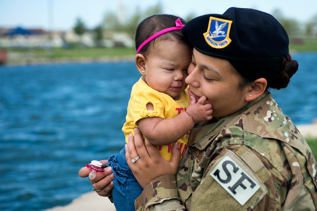 A mother plays with her daughter.