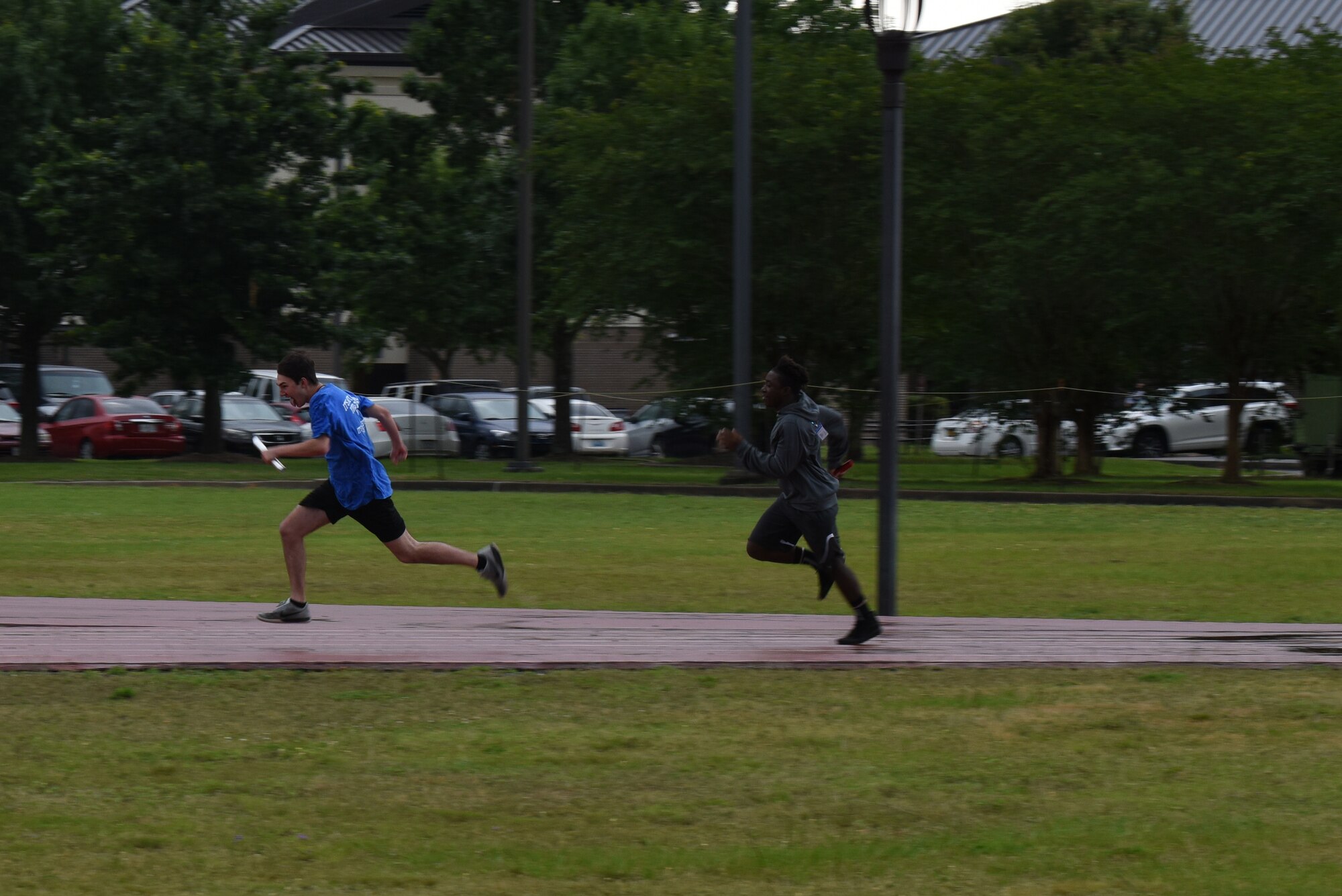 Area 11 special olympic athletes compete in an unified relay during the Special Olympics Mississippi 2019 Summer Games, May 11, 2019 at Keesler Air Force Base, Mississippi. This is the first year that unified relays have been done during the Special Olympics Mississippi Summer Games. It is a product of a program that allows special olympics athletes and able-bodied athletes from local Mississippi high schools come together to compete in a 4x400 relay. (U.S. Air Force photo by Senior Airman Jenay Randolph)