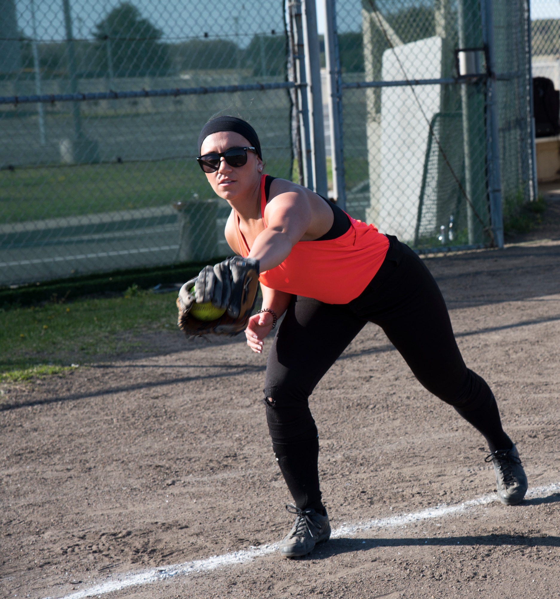 U.S. Air Force Staff Sgt. Danielle Clemons, a 35th Medical Operations Squadron primary care office manager, warms up before the 2019 Cinco de Mayo softball tournament by catching and throwing pitches at Misawa Air Base, Japan, May 4, 2019. Five teams competed giving Airmen the opportunity to connect with others and build team cohesion. (U.S. Air Force photo by Branden Yamada)