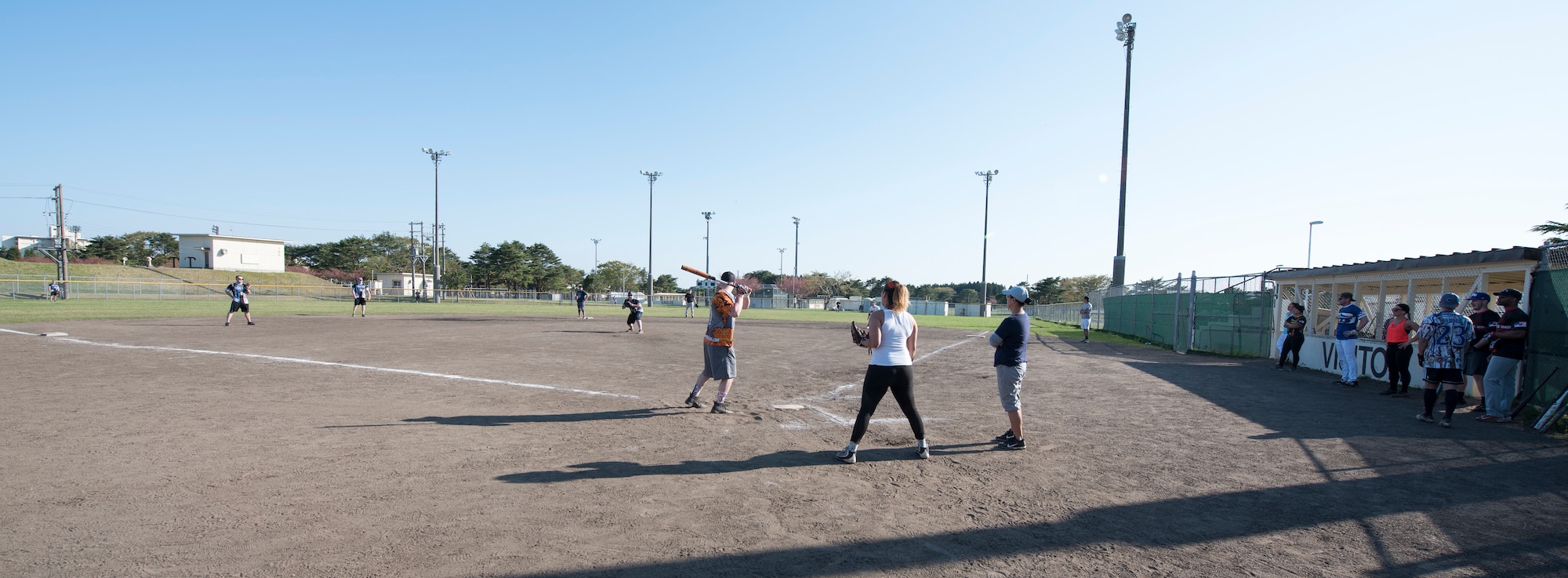 The 35th Security Forces Squadron and 35th Medical Operations Squadron compete in a match during the 2019 Cinco de Mayo softball tournament at Misawa Air Base, Japan, May 4, 2019.  Both teams played the opening match for the tournament, garnering spectators and supporting relations with neighboring units on Misawa Air Base. (U.S. Air Force photo by Branden Yamada)