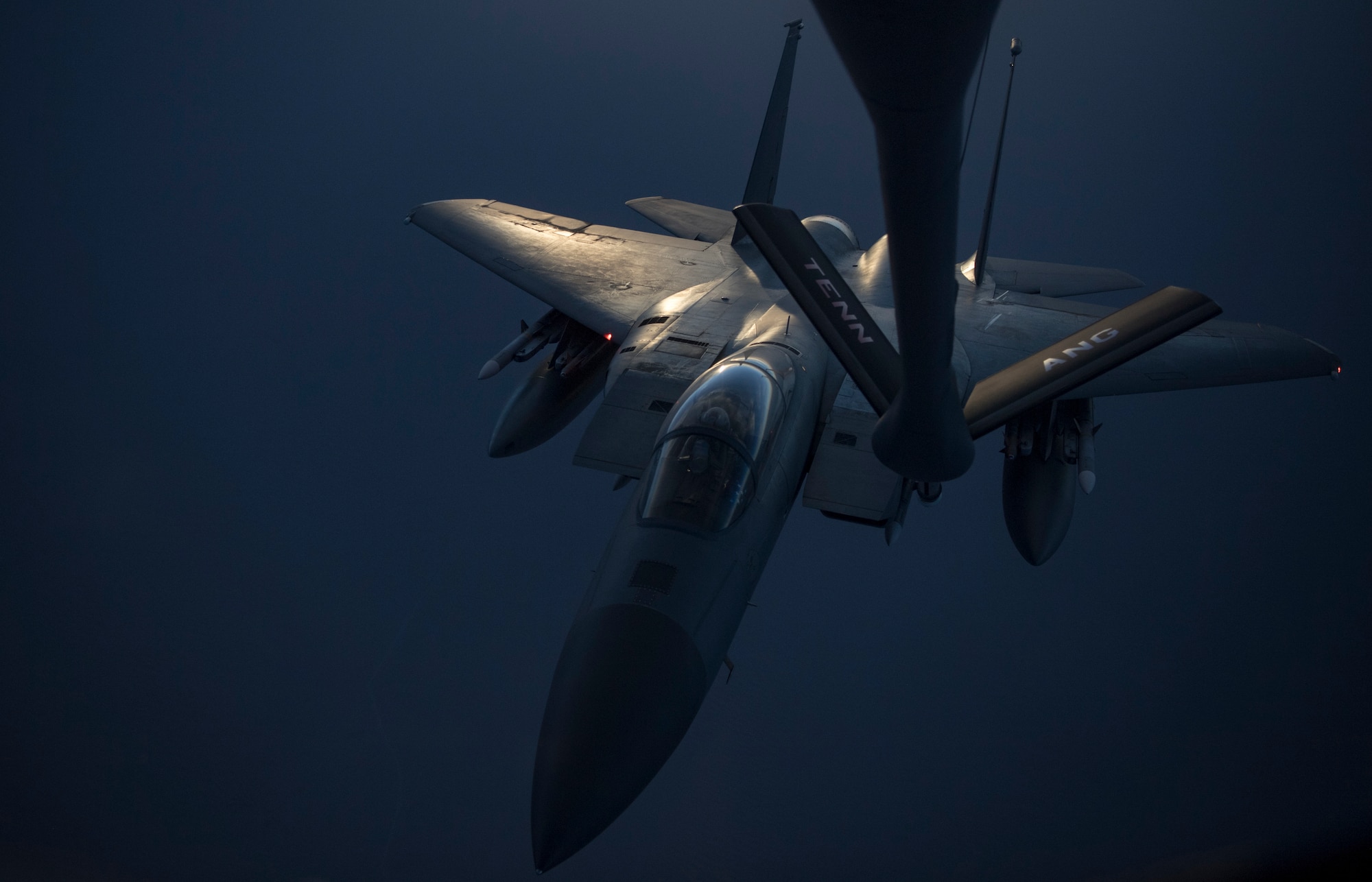 A photo of an F-15C Eagle performing a midair refueling.