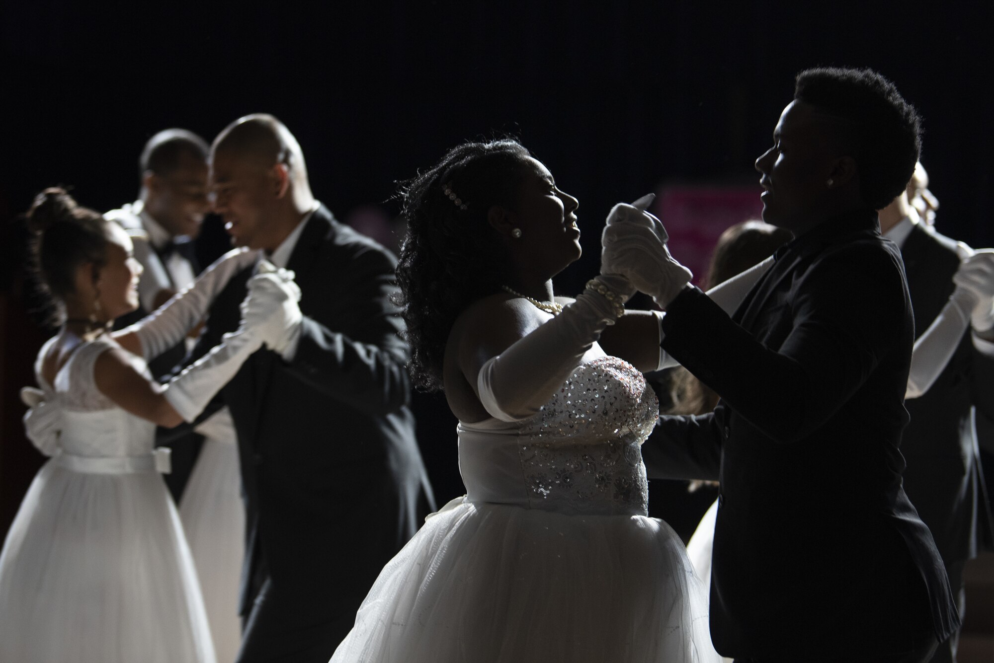 Spangdahlem High School and Middle School students dance with their dates during the Preparing and Equipping Ambassadors to be Resilient Leaders program banquet at Spangdahlem Air Base, Germany, May 10, 2019. Several of the high-performing students won awards and scholarships to recognize their qualities, such as leadership skills. (U.S. Air Force photo by Airman 1st Class Valerie Seelye)