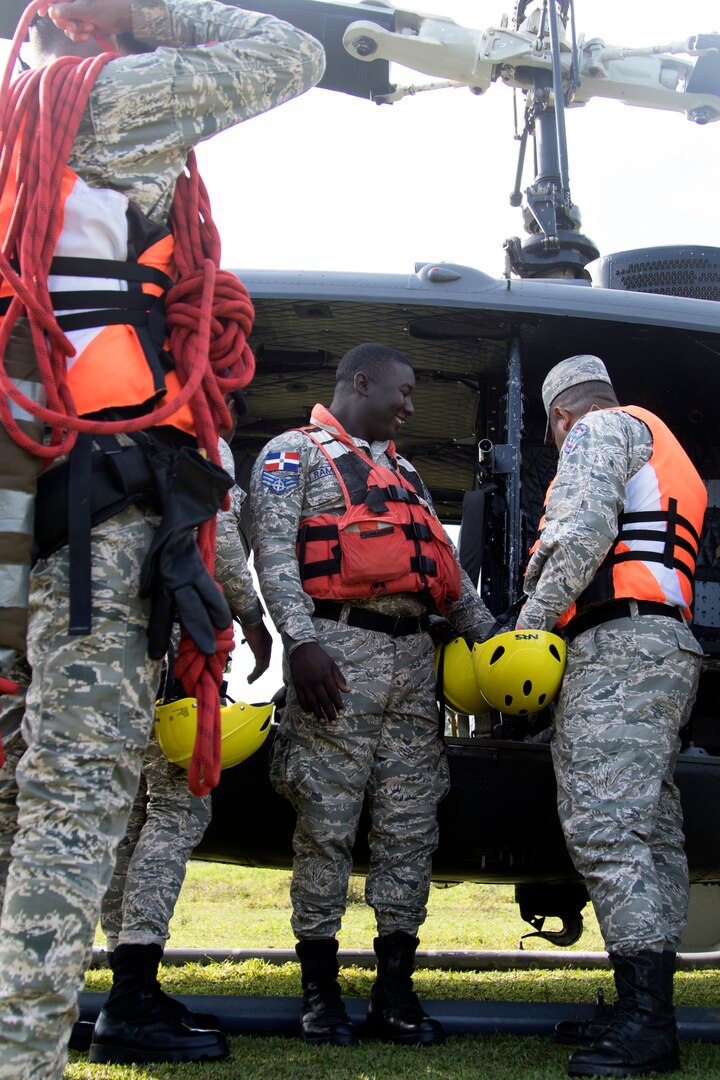 Members of the Dominican Republic Air Force search and rescue squadron prepare for a water-rescue exercise as part of a simulated flood-response within Fuerezas Aliadas Humanitarias 2019 near Bajo Yuna, Dominican Republic May 9, 2019.