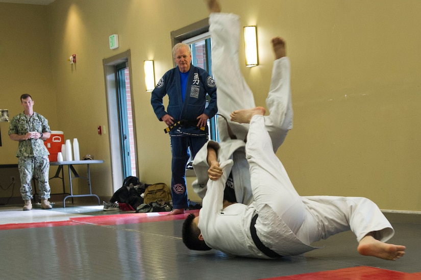 Nuclear Electronics Technician 3rd Class Austin Hronek, Navy Nuclear Power Training Command student, bottom, demonstrates Judo and Ju-Jitsu martial arts during the Asian American Pacific Islander Heritage Month Cultural Showcase on May 7, 2019, at the Air Base Chapel.