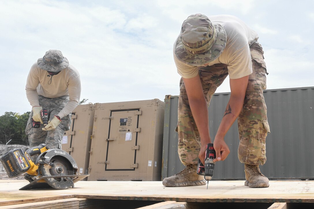 U.S. Air Force Airmen construct flooring for the kitchen tent during New Horizons exercise 2019 at Camp Seweyo, Guyana, May 11, 2019.