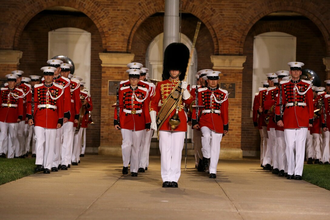Marines with “The President’s Own,” U.S. Marine Band, march down Center Walk during a Friday Evening Parade at Marine Barracks Washington, D.C., May 10, 2019.The guest of honor for the parade was the Honorable, David L. Norquist, Under Secretary of Defense (Comptroller)/Chief Financial Officer and performing the duties of the Deputy Secretary of Defense and the hosting official was the Assistant Commandant of the Marine Corps, Gen. Gary L. Thomas. (U.S. Marine Corps photo by Pfc. Allen Sanders)