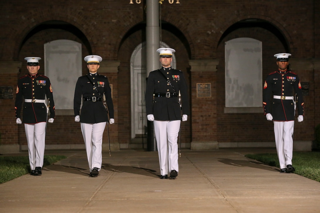 Marines with the parade staff, Marine Barracks Washington D.C., march down Center Walk during a Friday Evening Parade at the Barracks, May 10, 2019.The guest of honor for the parade was the Honorable, David L. Norquist, Under Secretary of Defense (Comptroller)/Chief Financial Officer and performing the duties of the Deputy Secretary of Defense and the hosting official was the Assistant Commandant of the Marine Corps, Gen. Gary L. Thomas. (U.S. Marine Corps photo by Pfc. Allen Sanders)