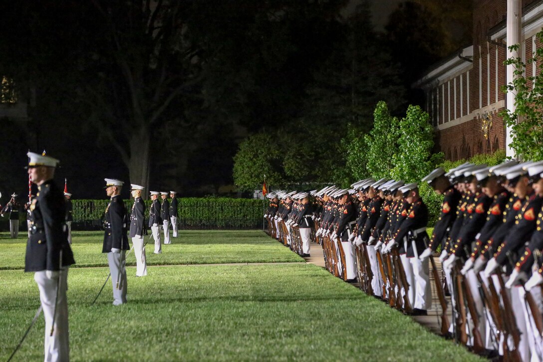 Marines with Alpha and Bravo marching companies, Marine Barracks Washington D.C., perform “fix bayonets” during a Friday Evening Parade at the Barracks, May 10, 2019.The guest of honor for the parade was the Honorable, David L. Norquist, Under Secretary of Defense (Comptroller)/Chief Financial Officer and performing the duties of the Deputy Secretary of Defense and the hosting official was the Assistant Commandant of the Marine Corps, Gen. Gary L. Thomas. (U.S. Marine Corps photo by Pfc. Allen Sanders)