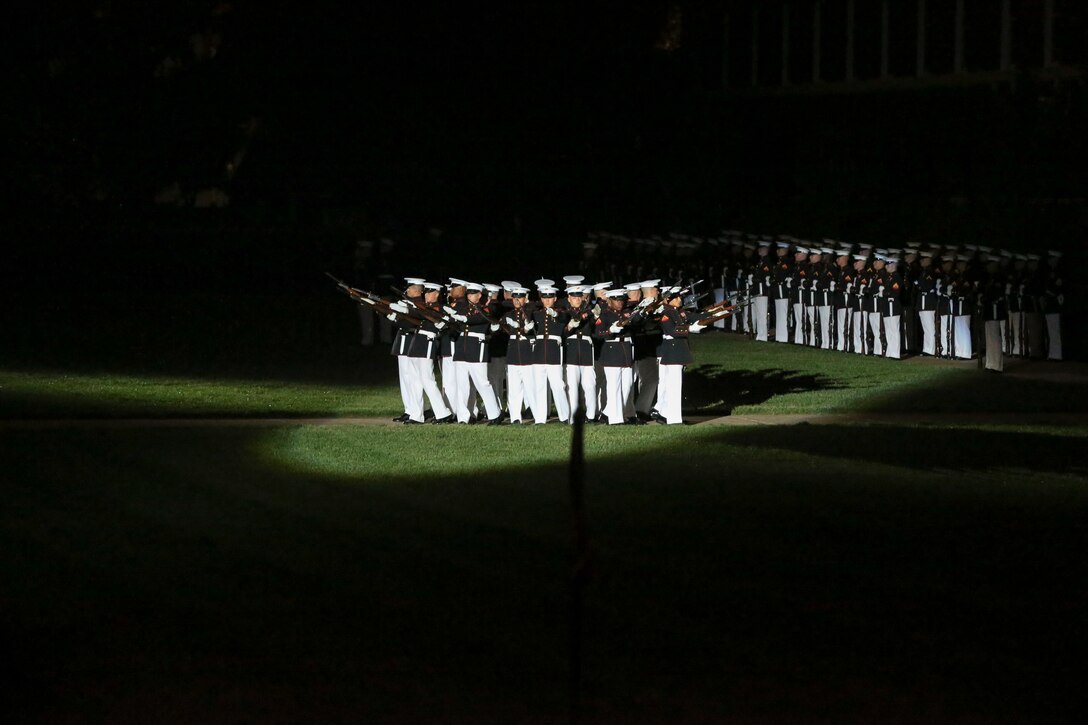 Marines with the U.S. Marine Corps Silent Drill Platoon perform their “bursting bomb” sequence during a Friday Evening Parade at Marine Barracks Washington, D.C., May 10, 2019.The guest of honor for the parade was the Honorable, David L. Norquist, Under Secretary of Defense (Comptroller)/Chief Financial Officer and performing the duties of the Deputy Secretary of Defense and the hosting official was the Assistant Commandant of the Marine Corps, Gen. Gary L. Thomas. (U.S. Marine Corps photo by Pfc. Allen Sanders)