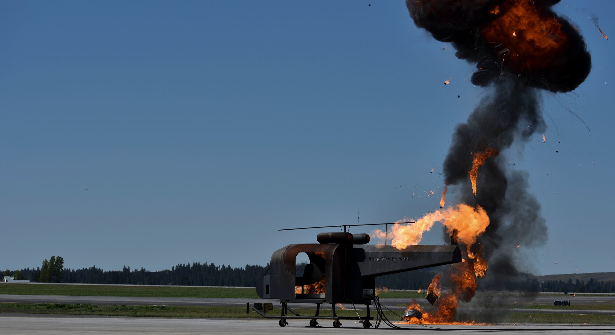A helicopter crash trainer from Joint Base Lewis McChord, Washington, is on fire while Team Fairchild simulated an explosion during a Major Accident Response Exercise at Fairchild Air Force Base, May 9, 2019.
