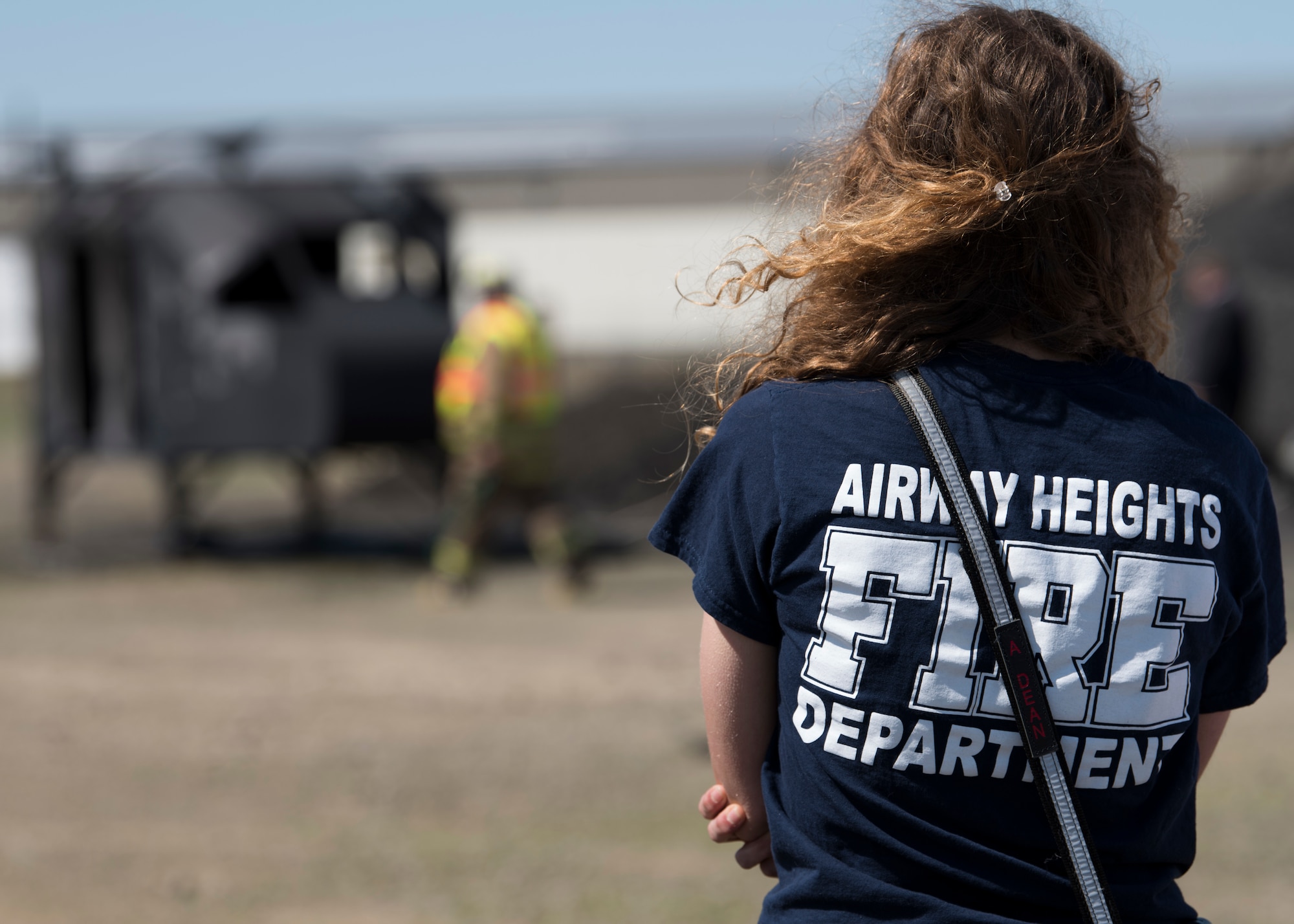 A firefighter from the Airway Heights Fire Department observes preparations for a Major Accident Response Exercise drill near Fairchild Air Force Base, Washington, May 9, 2019.