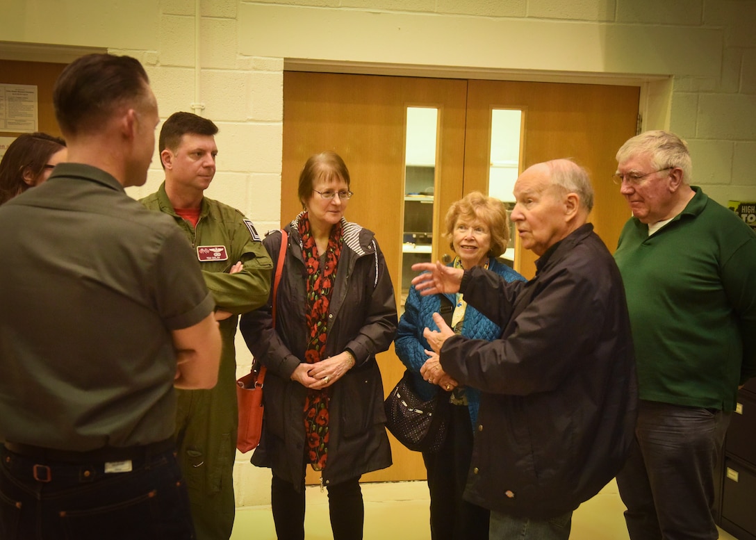 Retired U.S. Air Force Col. Thomas Domingues speaks with friends, family and a pilot about his Air Force career during a visit at RAF Mildenhall, England, May 10, 2019. Domingues flew aerial refueling missions in the KC-135 during the Vietnam War and visited the base as part of a surprise visit set up by his friends and family. (U.S. Air Force photo by Airman 1st Class Joseph Barron)
