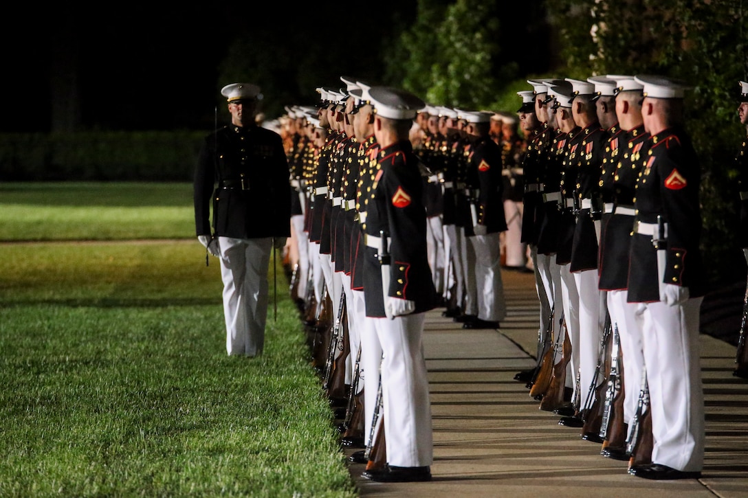 Marines with Alpha and Bravo marching companies, Marine Barracks Washington D.C., perform “dress right dress” during a Friday Evening Parade at the Barracks, May 10, 2019. The guest of honor for the parade was the Honorable, David L. Norquist, Under Secretary of Defense (Comptroller)/Chief Financial Officer and performing the duties of the Deputy Secretary of Defense, and the hosting official was the Assistant Commandant of the Marine Corps, Gen. Gary L. Thomas. (U.S. Marine Corps photo by Sgt. Robert Knapp/Released)