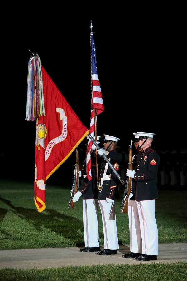 Marines with the U.S. Marine Corps Color Guard present the National Flag during a Friday Evening Parade at Marine Barracks Washington D.C., May 10, 2019. The guest of honor for the parade was the Honorable, David L. Norquist, Under Secretary of Defense (Comptroller)/Chief Financial Officer and performing the duties of the Deputy Secretary of Defense, and the hosting official was the Assistant Commandant of the Marine Corps, Gen. Gary L. Thomas. (U.S. Marine Corps photo by Sgt. Robert Knapp/Released)