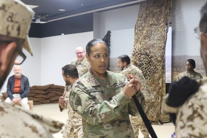 U.S. Army Sgt. 1st Class Misbah Bailey, 8th Medical Brigade, speaks about tourniquets during a medical subject matter expert exchange at the Crown Prince Center of Training and Medical Research in Bahrain,  April 15, 2019.
