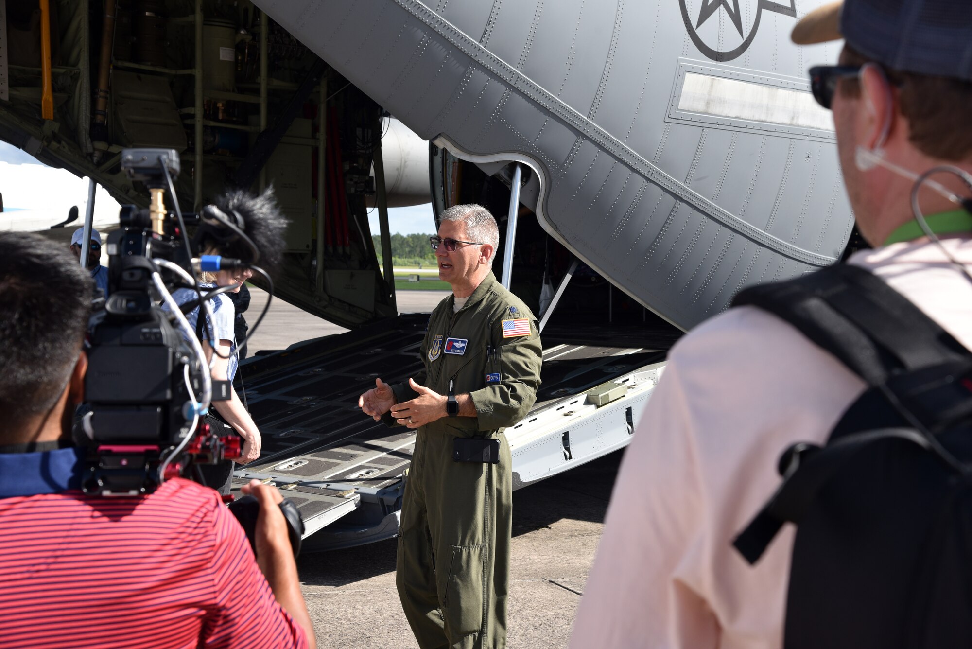 Lt. Col. Jeff Ragusa, 53rd Weather Reconnaissance Squadron chief pilot, explains the capabilities of the WC-130J Super Hercules during a media tour of the aircraft May 10, 2019, in Brunswick, Georgia. Media tours were given during the Hurricane Awareness Tour to help create a weather-ready nation by raising awareness for the upcoming hurricane season occurring June 1-Nov. 30, with emphasis this year on raising awareness about inland flooding. (U.S. Air Force photo by Tech. Sgt. Christopher Carranza)