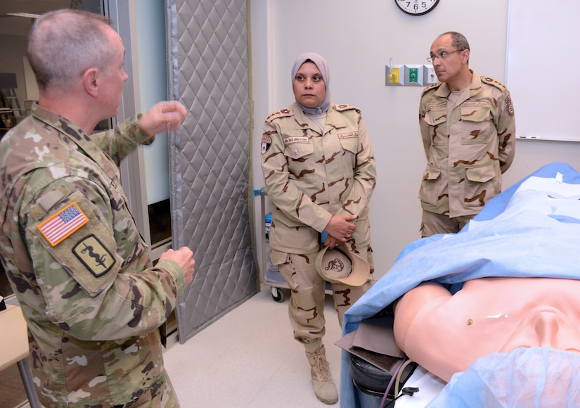 LTC Steven Kertes, Deputy Director of the U.S. Army Graduate Program in Anesthesia Nursing, briefs BG Mohamed  Sherif and BG Hala Ahmed of the Egyptian Ministry of Defense on details of the program.