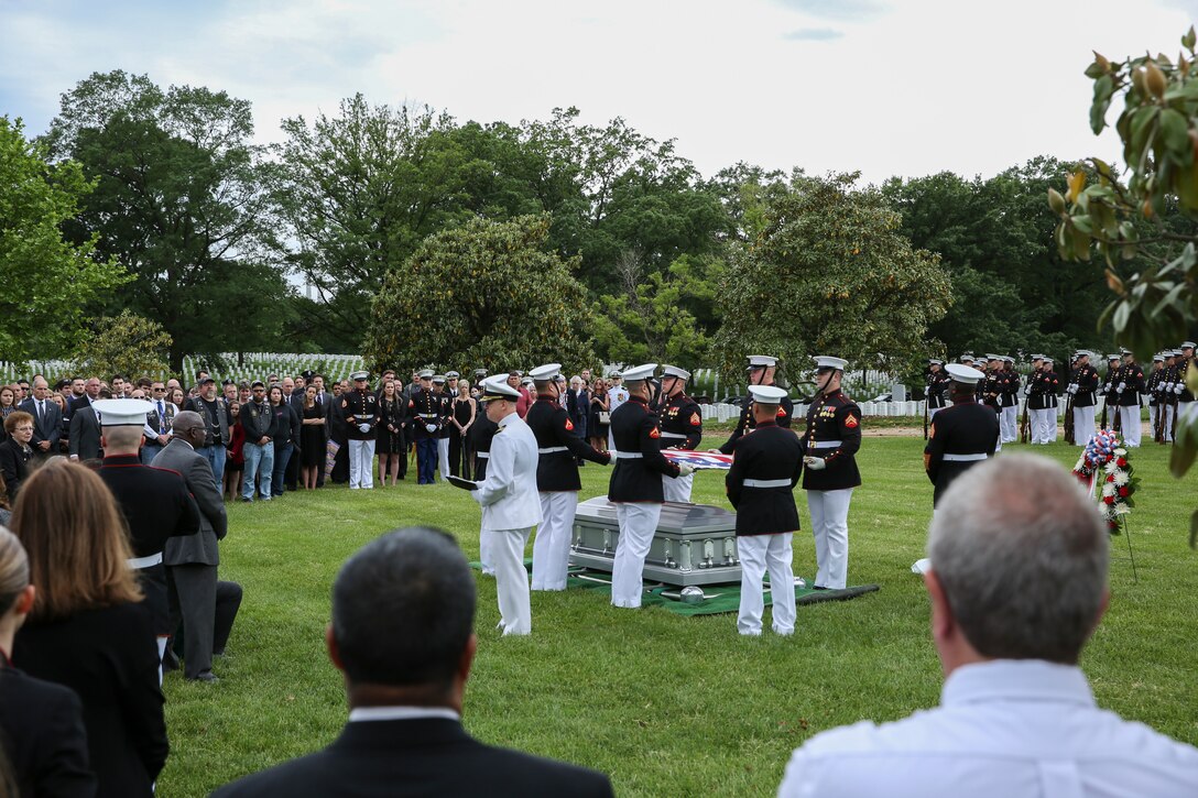Marine Corps Body Bearers, Bravo Company, Marine Barracks Washington D.C., hold the National Flag during a full honors funeral for Staff Sgt. Benjamin S. Hines at Arlington National Cemetery, Arlington, Virginia, May 10, 2019. Hines was killed in action on Monday April 8, 2019 in Afghanistan, alongside two of his fellow Marines while deployed with the 25th Marine Regiment, 4th Marine Division, Marine Forces Reserve. The unit deployed as a part of a NATO program to train and advise Georgian infrany troops. (U.S. Marine Corps photo by Sgt. Robert Knapp/Released)